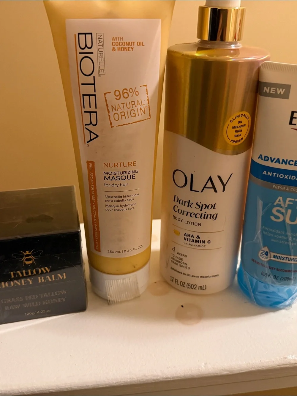 OLAY Dark Spot Correcting Body Lotion in gold and white bottle